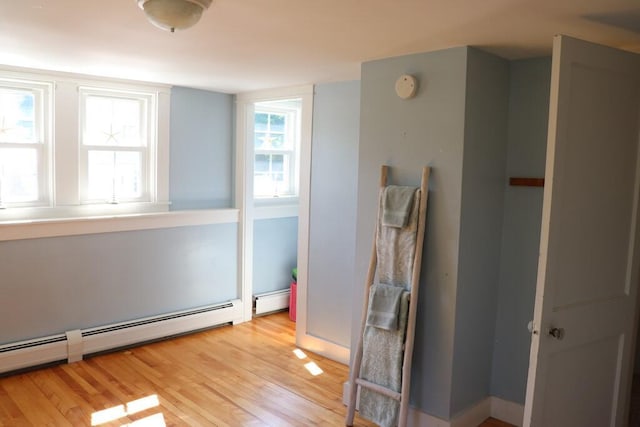 interior space featuring a baseboard radiator and wood-type flooring