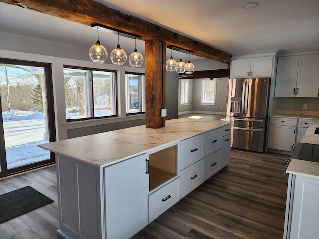 61 Hathaway Hill Rd, Livermore, ME 04253 - kitchen featuring stainless steel refrigerator with ice dispenser, dark wood-type flooring, light stone counters, hanging light fixtures, and beamed ceiling