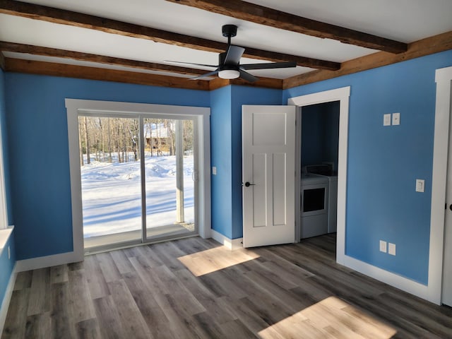 61 Hathaway Hill Rd, Livermore, ME 04253 - empty room featuring washer and clothes dryer, baseboards, beamed ceiling, ceiling fan, and wood finished floors