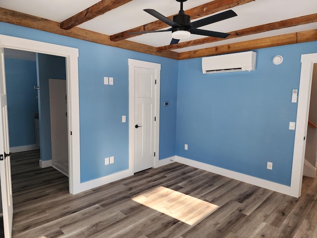 61 Hathaway Hill Rd, Livermore, ME 04253 - unfurnished bedroom with a wall mounted air conditioner, beam ceiling, baseboards, dark wood-type flooring, and ceiling fan