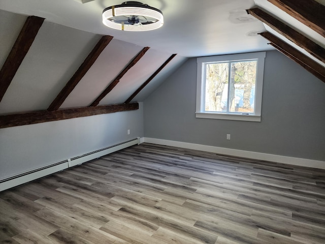 61 Hathaway Hill Rd, Livermore, ME 04253 - bonus room featuring a baseboard radiator, lofted ceiling, wood finished floors, and baseboards