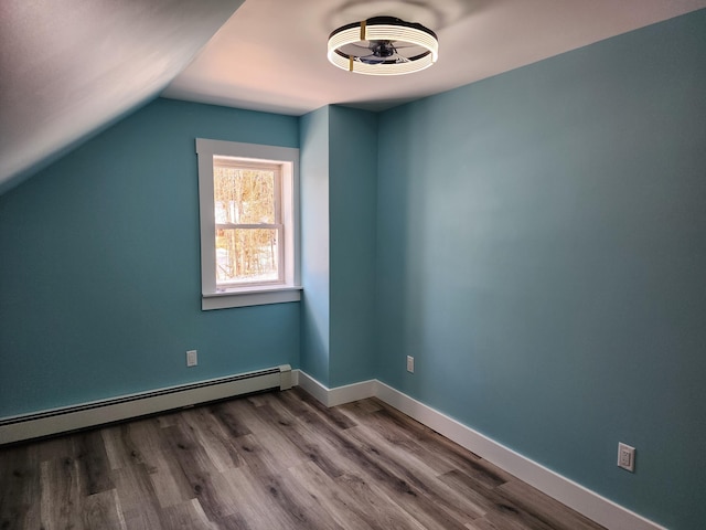 61 Hathaway Hill Rd, Livermore, ME 04253 - additional living space with dark wood-type flooring, lofted ceiling, baseboard heating, and baseboards