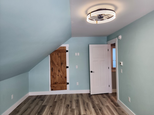 61 Hathaway Hill Rd, Livermore, ME 04253 - additional living space with wood finished floors, vaulted ceiling, and baseboards