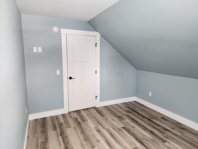 61 Hathaway Hill Rd, Livermore, ME 04253 - additional living space featuring wood finished floors, vaulted ceiling, and baseboards