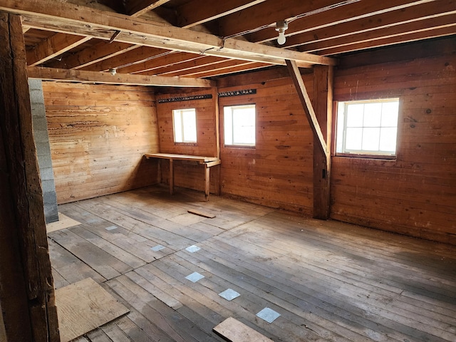 61 Hathaway Hill Rd, Livermore, ME 04253 - basement with hardwood / wood-style floors and wood walls