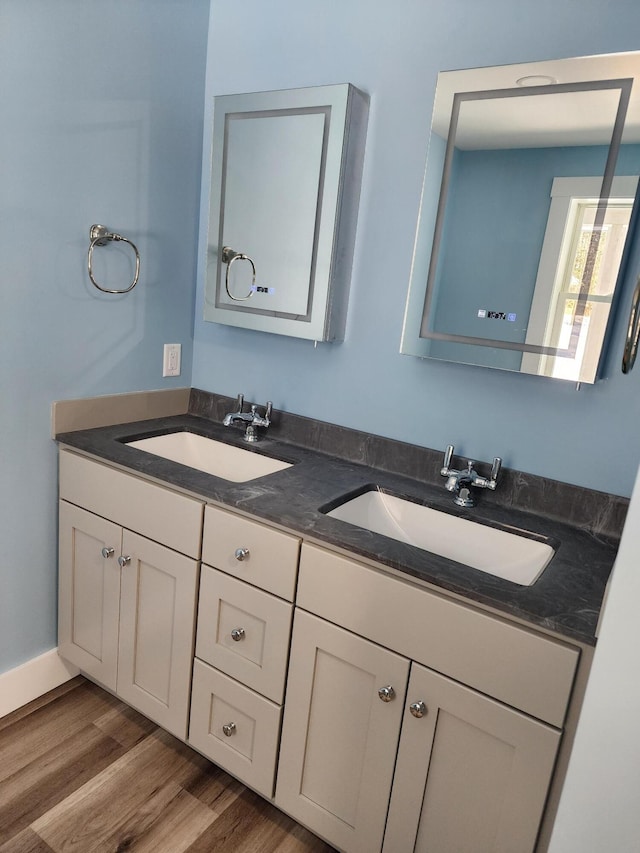 61 Hathaway Hill Rd, Livermore, ME 04253 - full bath featuring double vanity and wood finished floors