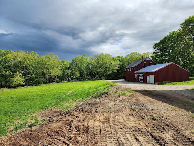 61 Hathaway Hill Rd, Livermore, ME 04253 - view of grassy yard with an outdoor structure and an outbuilding