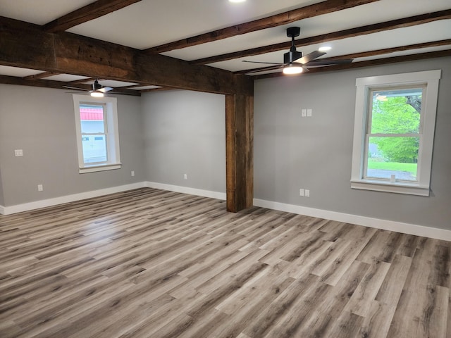 61 Hathaway Hill Rd, Livermore, ME 04253 - spare room with a ceiling fan, plenty of natural light, wood finished floors, and beamed ceiling