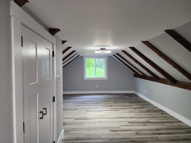 61 Hathaway Hill Rd, Livermore, ME 04253 - additional living space with wood finished floors, vaulted ceiling, and baseboards