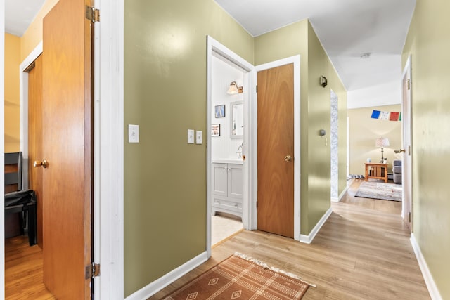 hallway with light wood-type flooring