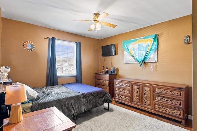 bedroom featuring ceiling fan and hardwood / wood-style floors