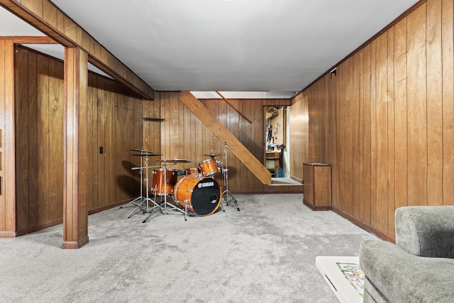 interior space with wooden walls and light carpet