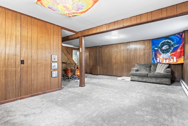 interior space featuring light colored carpet and wood walls