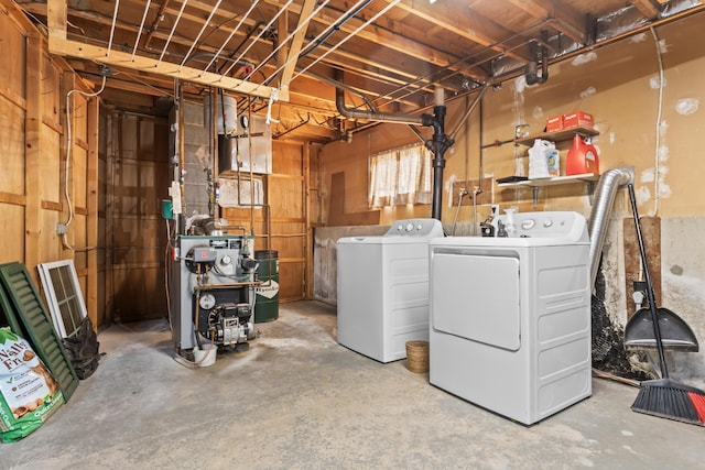 clothes washing area featuring washing machine and clothes dryer