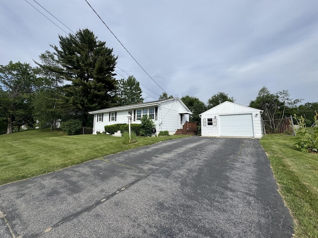 7 Meadow Ln, Lewiston, ME 04240 - view of front of house featuring an outdoor structure, asphalt driveway, a garage, and a front lawn