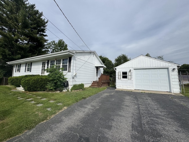 7 Meadow Ln, Lewiston, ME 04240 - view of side of home with an outdoor structure, a garage, and driveway
