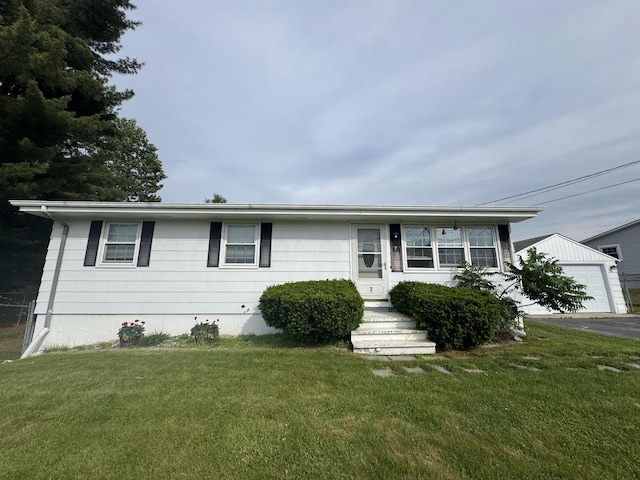 7 Meadow Ln, Lewiston, ME 04240 - view of front of house with a front yard, a garage, and an outdoor structure