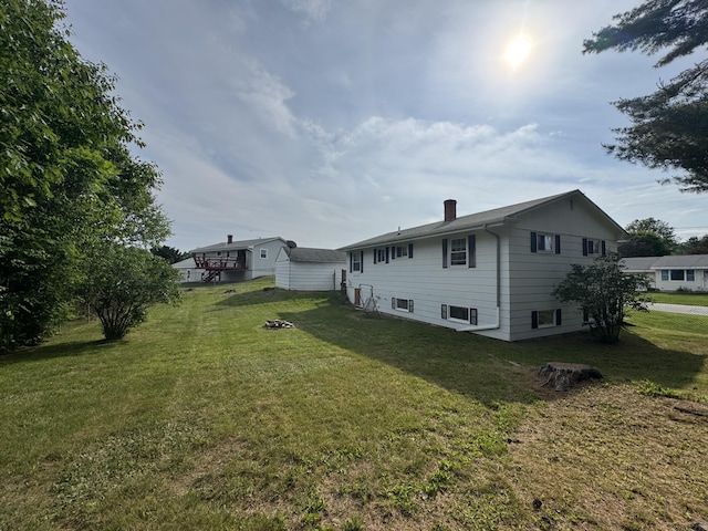7 Meadow Ln, Lewiston, ME 04240 - rear view of property featuring a yard and a chimney