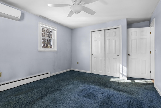 unfurnished bedroom with a wall unit AC, ceiling fan, dark colored carpet, a baseboard heating unit, and a closet