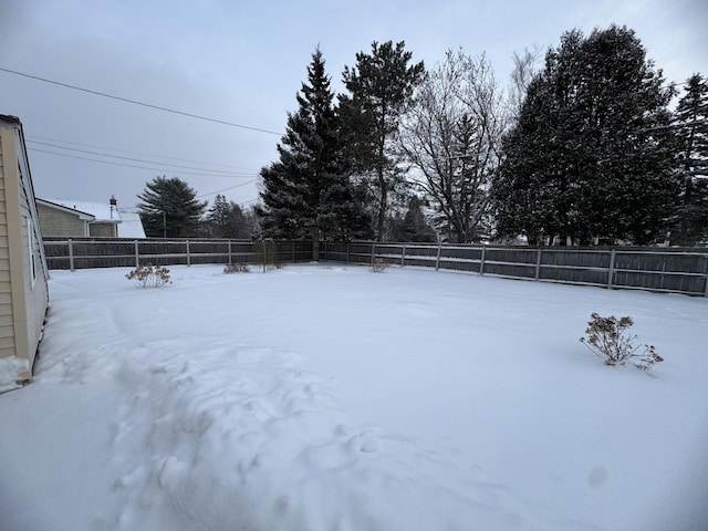 view of yard covered in snow