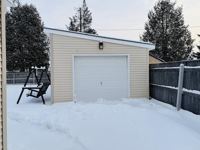 view of snow covered garage