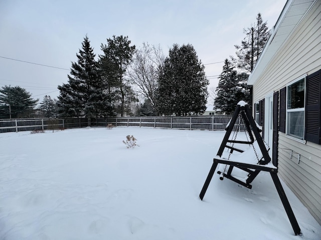 view of yard layered in snow