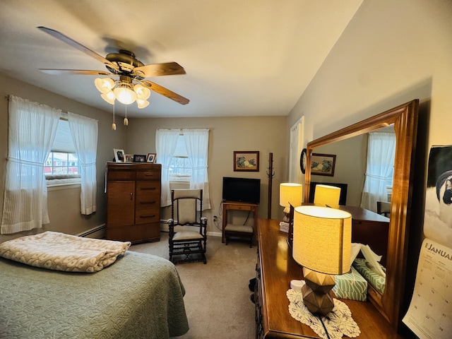 bedroom featuring baseboard heating, carpet, and ceiling fan