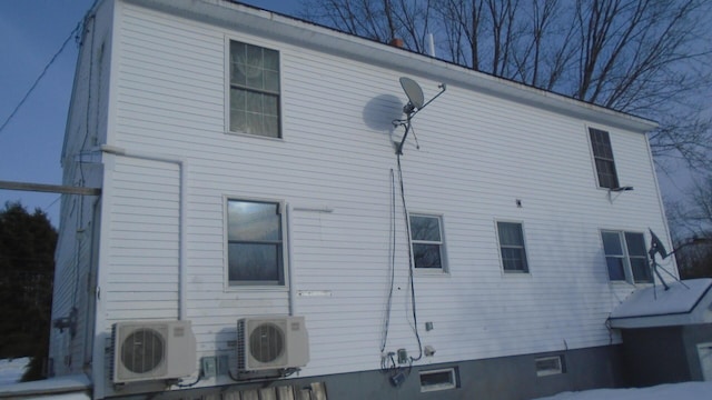 view of side of property with ac unit