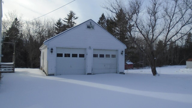 view of snow covered garage