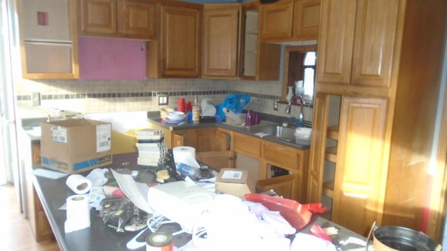 kitchen with decorative backsplash and sink