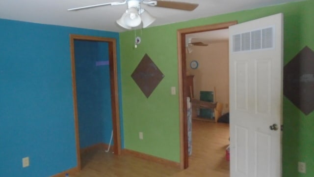 bedroom with ceiling fan and light hardwood / wood-style flooring