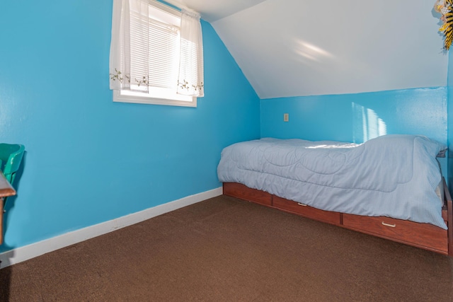 carpeted bedroom featuring lofted ceiling