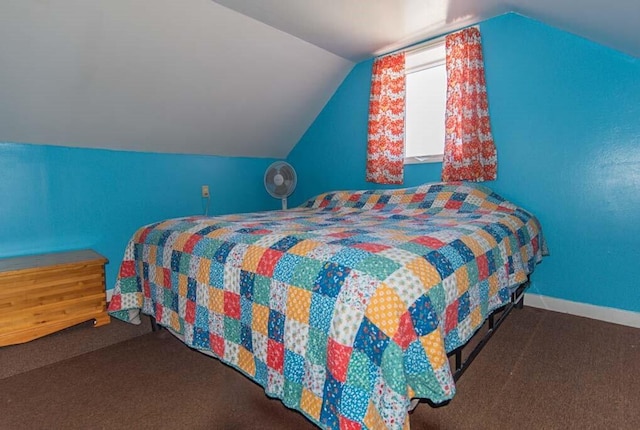 carpeted bedroom featuring lofted ceiling