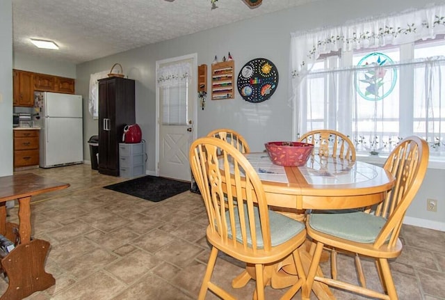 dining area with a textured ceiling