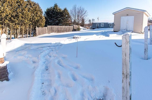 view of yard layered in snow