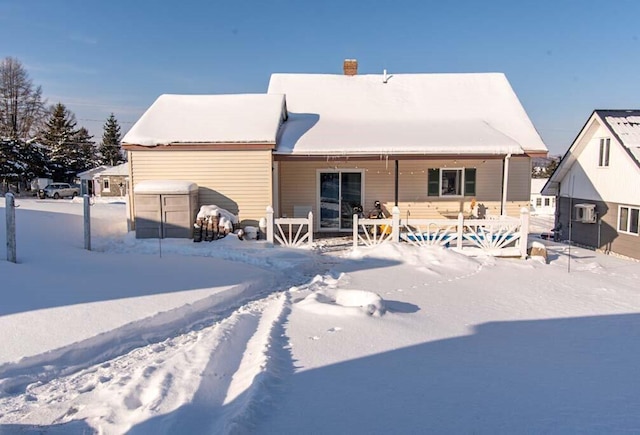 view of snow covered house