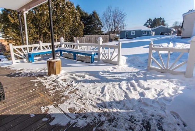 snow covered pool with a deck