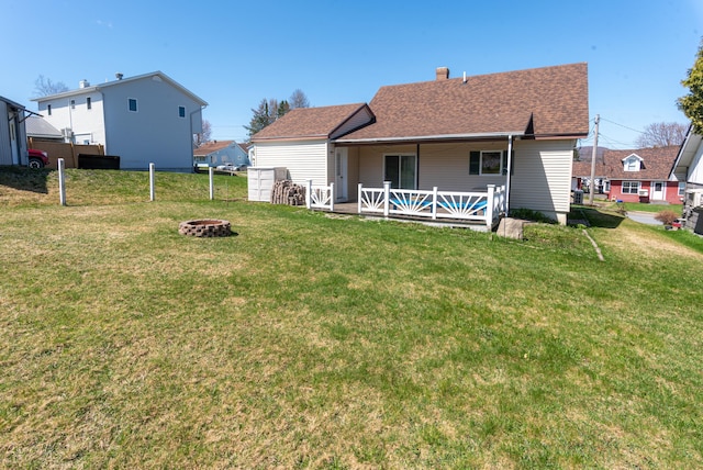 186 Mountain View Ave, Madawaska, ME 04756 - rear view of property featuring an outdoor fire pit, a chimney, and a shingled roof