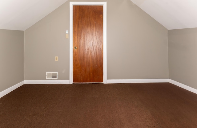 186 Mountain View Ave, Madawaska, ME 04756 - additional living space featuring lofted ceiling, baseboards, and dark colored carpet