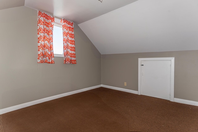 186 Mountain View Ave, Madawaska, ME 04756 - additional living space with vaulted ceiling, carpet flooring, and baseboards