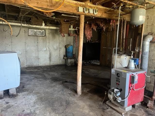 98 White Schoolhouse Rd, Corinth, ME 04427 - unfinished below grade area with a heating unit