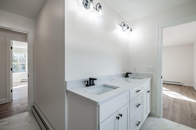 bathroom with vanity and a baseboard radiator