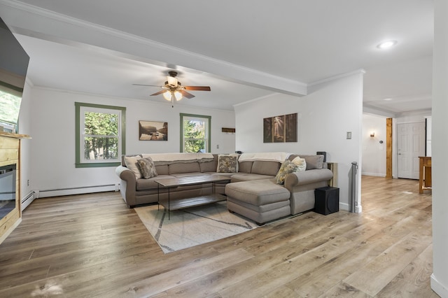 16 Hayden Hill Rd, Litchfield, ME 04350 - living room featuring healthy amount of natural light, crown molding, wood finished floors, a baseboard heating unit, and recessed lighting
