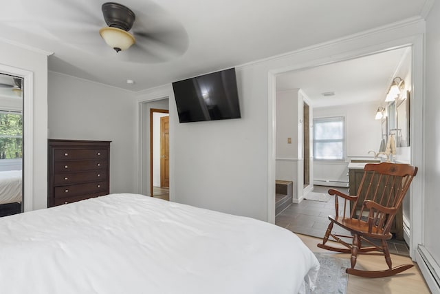 16 Hayden Hill Rd, Litchfield, ME 04350 - bedroom with a baseboard heating unit, a baseboard radiator, ornamental molding, and a ceiling fan