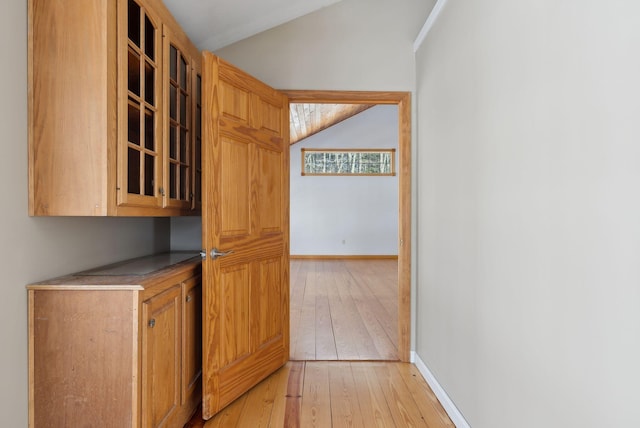 kitchen featuring light hardwood / wood-style flooring and lofted ceiling