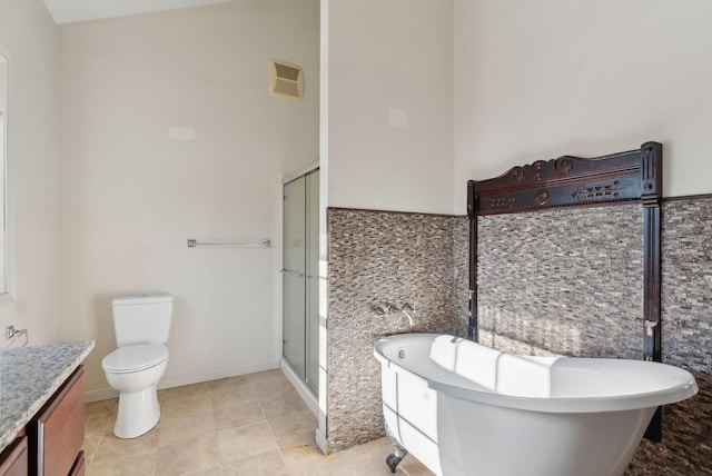 full bathroom featuring vanity, toilet, and shower with separate bathtub