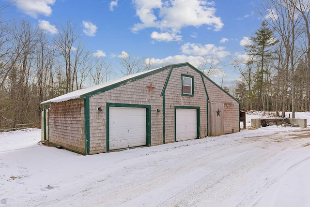 view of snow covered garage