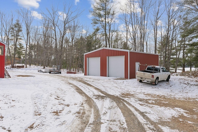 view of snow covered garage