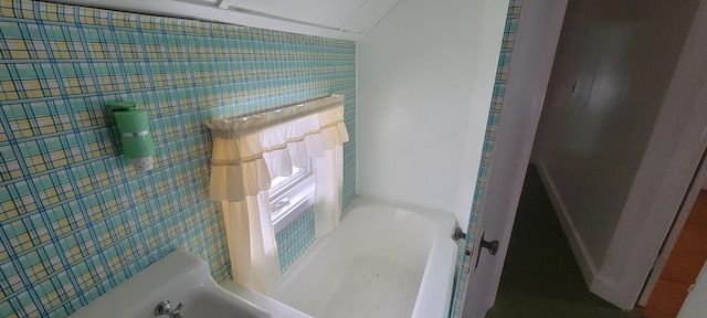 bathroom with a tub