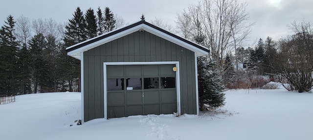 view of snow covered garage